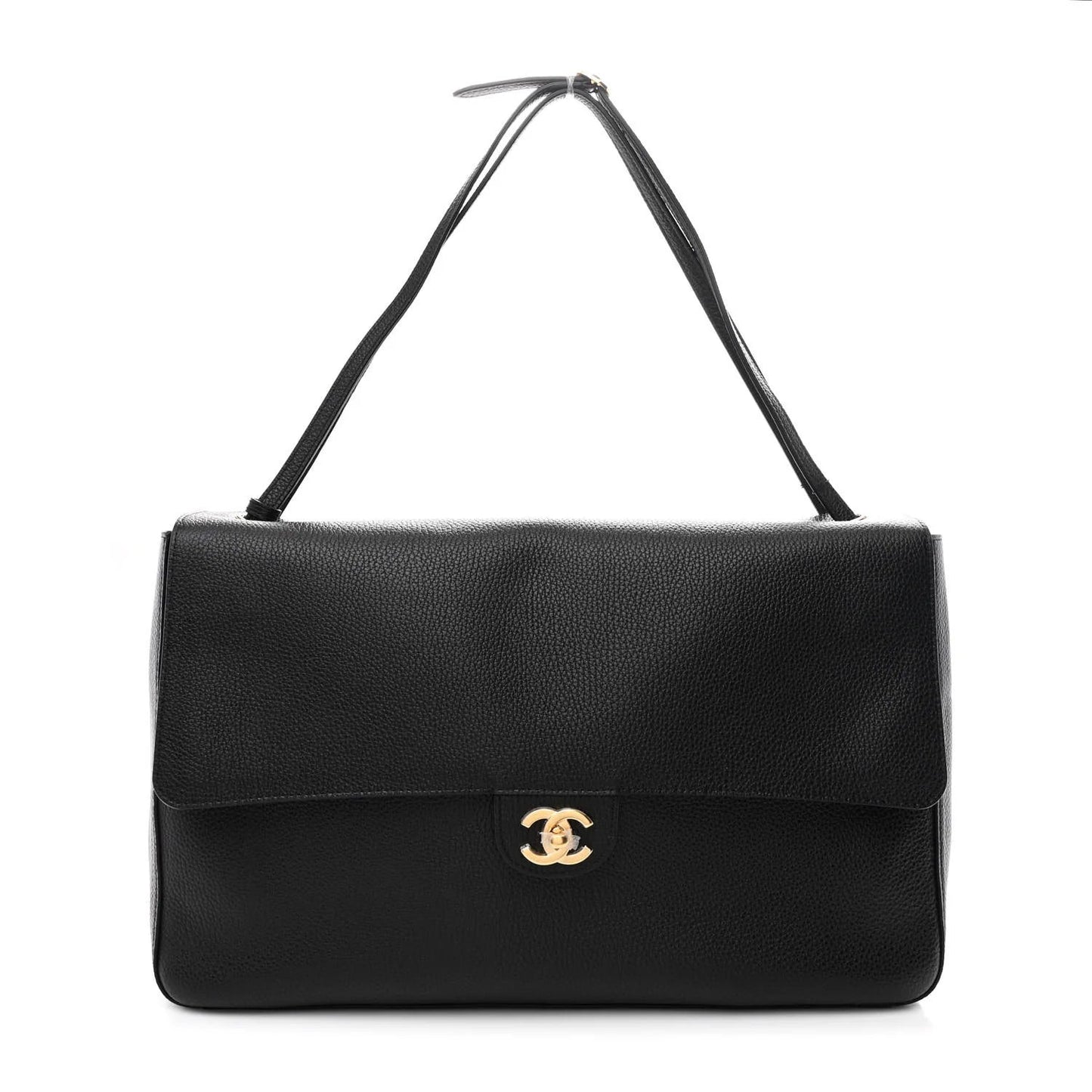 Black leather handbag with gold clasp on a white background