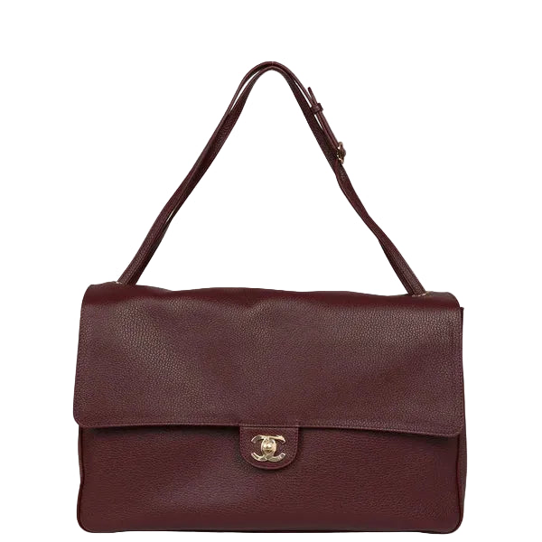 Burgundy  leather handbag with a visible brand logo on a white background