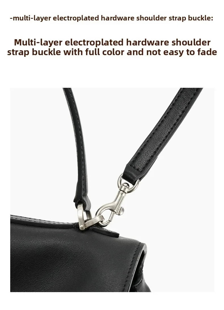 Close-up of a black leather shoulder strap buckle attachment with silver metal hardware on a white background, with descriptive text above.