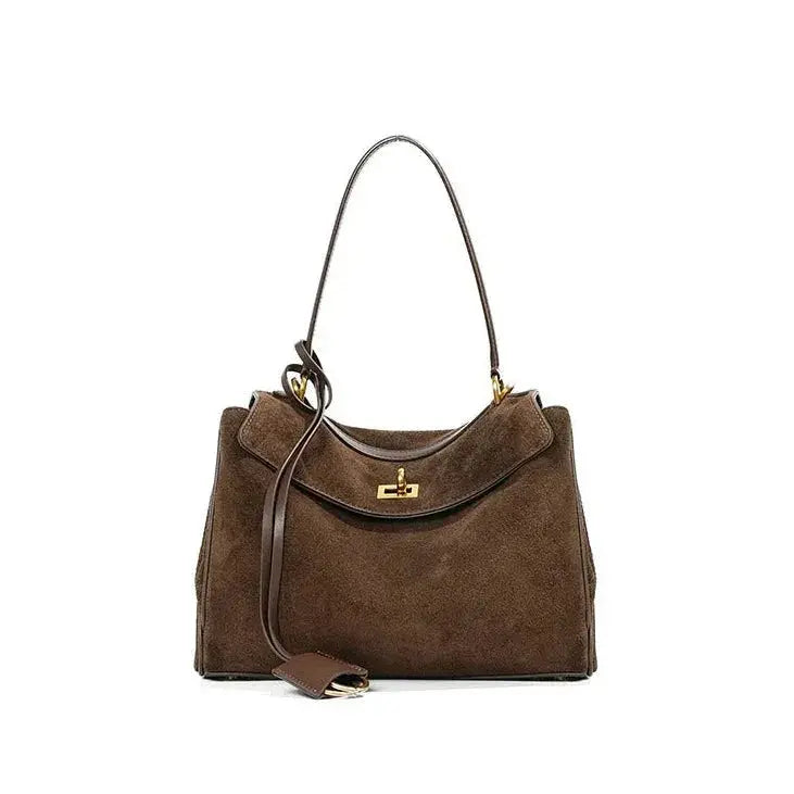 Brown handbag with a gold clasp on a white background