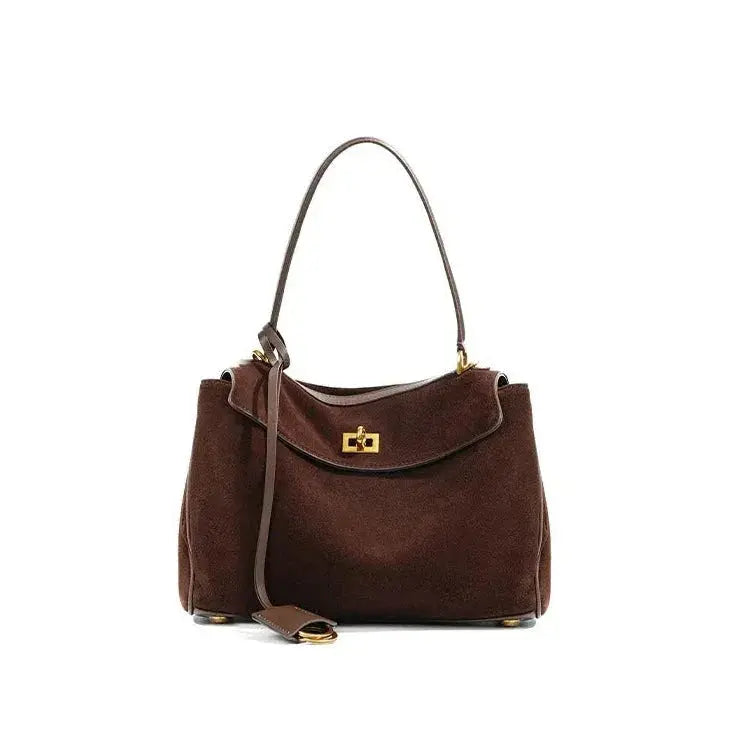 Brown handbag with a gold clasp on a white background