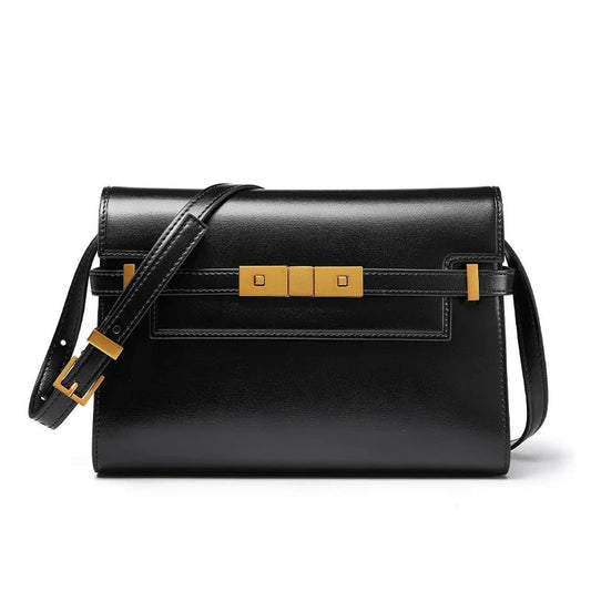 Black handbag with gold accents on a white background