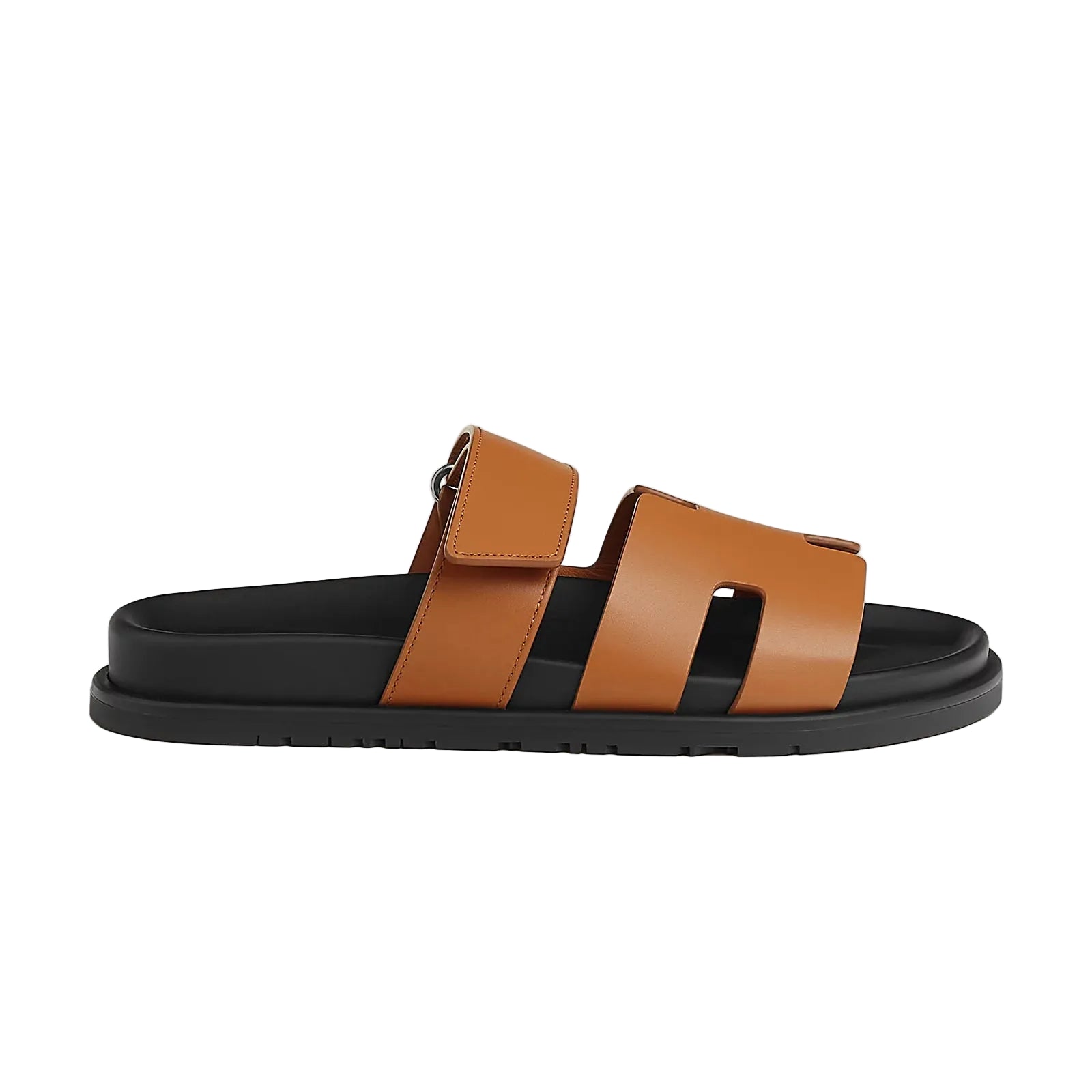 Brown sandal with black sole on a white background