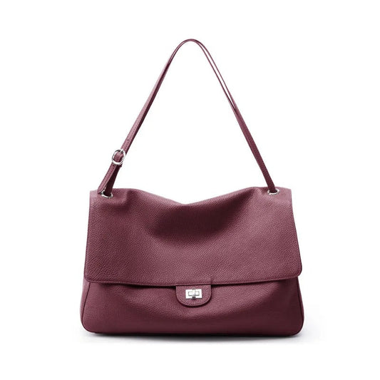 A burgundy pebbled leather shoulder bag with a single strap and a silver-tone turn-lock closure on the front flap, shown against a plain white background.