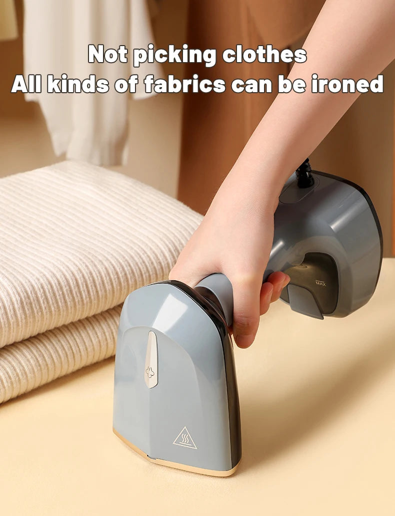 Hand holding a gray handheld steamer with text about ironing various fabrics.